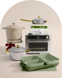 Kitchen appliances including a slow cooker, toaster oven, and green baking dishes on a neutral background.